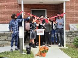 Group gathered for a Depaul USA ribbon-cutting ceremony